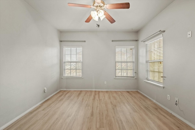 unfurnished room with ceiling fan and light wood-type flooring