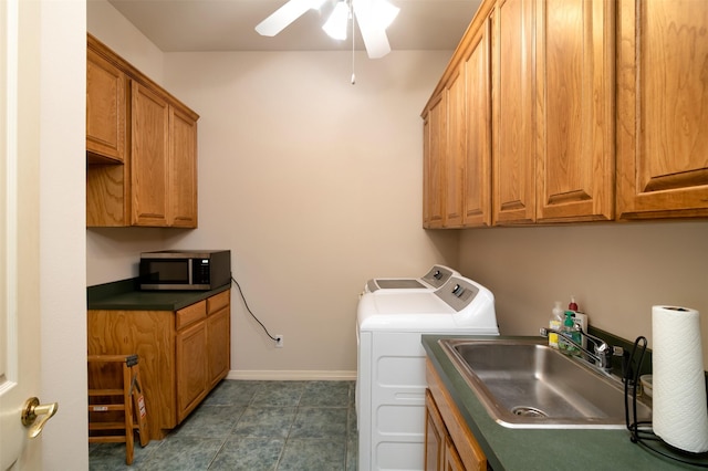 laundry area featuring washer and clothes dryer, ceiling fan, cabinets, and sink