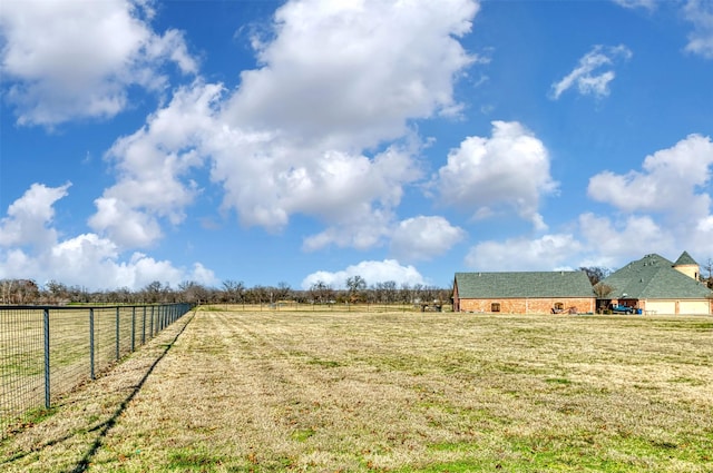 view of yard with a rural view