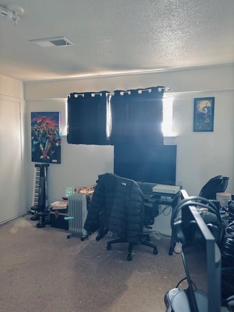 office area featuring a textured ceiling