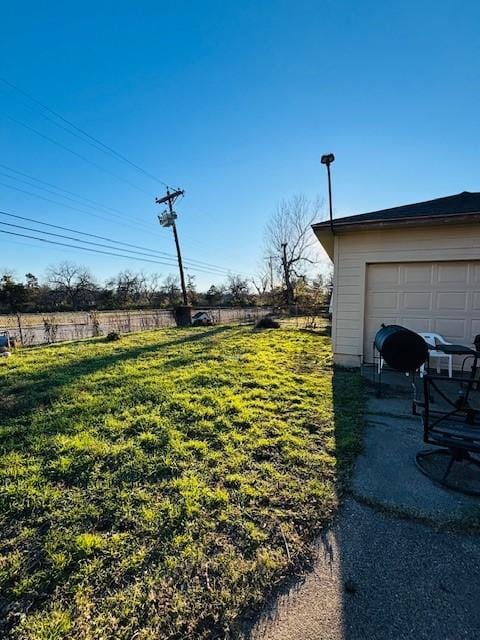 view of yard featuring a garage