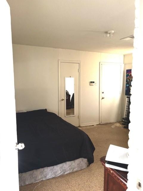 carpeted bedroom with a closet