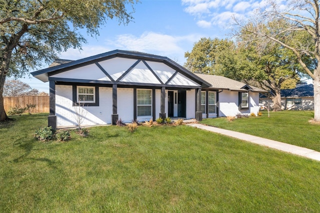 single story home featuring a front lawn