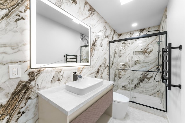 full bath featuring vanity, toilet, tile walls, recessed lighting, and a marble finish shower