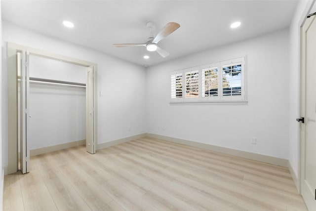 unfurnished bedroom featuring recessed lighting, light wood finished floors, and a closet