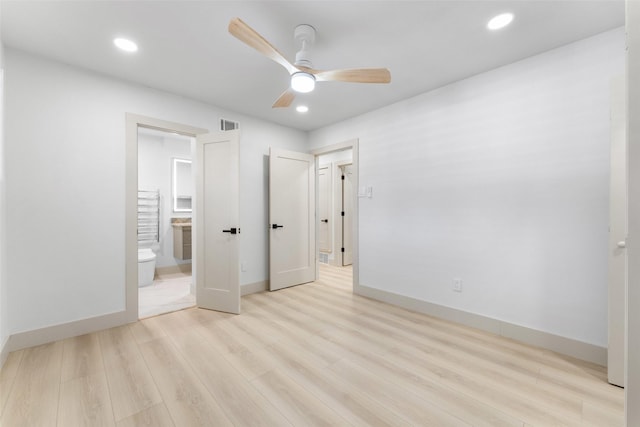 unfurnished bedroom with recessed lighting, baseboards, and light wood-type flooring