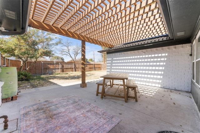 view of patio featuring outdoor dining area, a fenced backyard, and a pergola