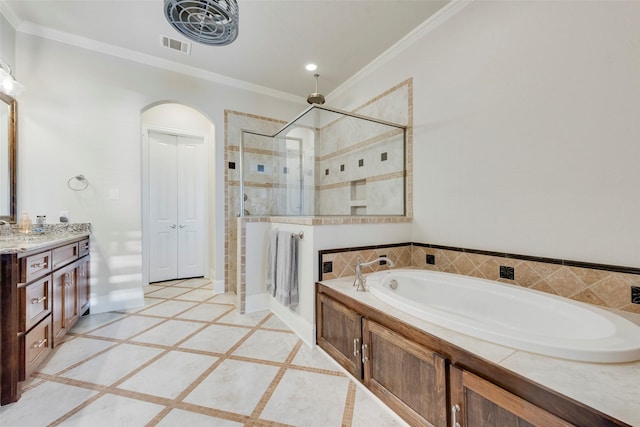 bathroom featuring plus walk in shower, vanity, and crown molding