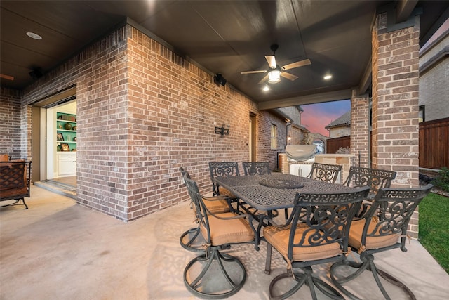 patio terrace at dusk with ceiling fan