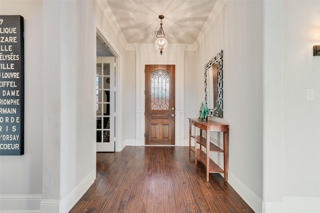 entryway with a chandelier and dark hardwood / wood-style floors