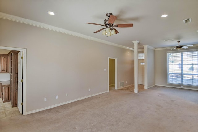 unfurnished living room featuring decorative columns, crown molding, ceiling fan, and light colored carpet