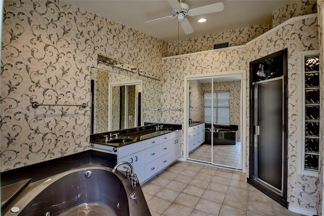 bathroom with tile patterned flooring, vanity, ceiling fan, and independent shower and bath