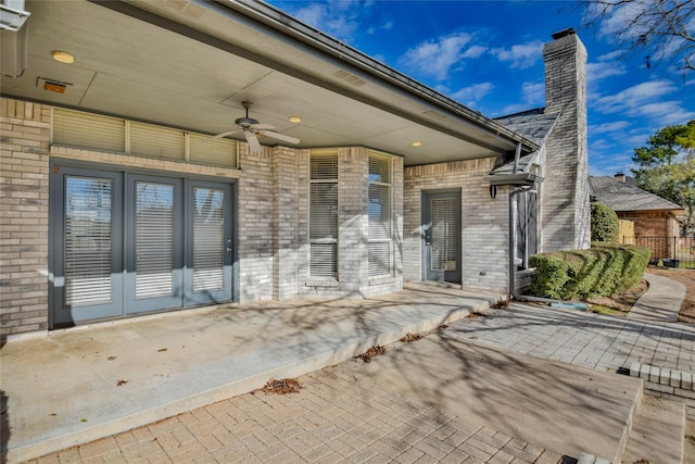 view of patio with french doors and ceiling fan