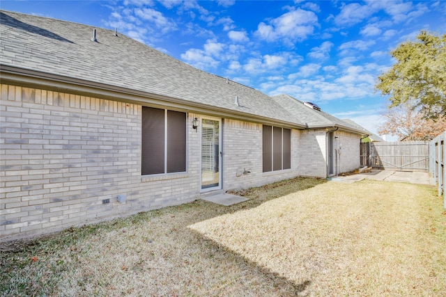 rear view of house with a lawn