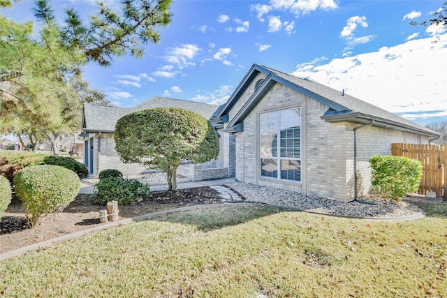 view of home's exterior with a yard