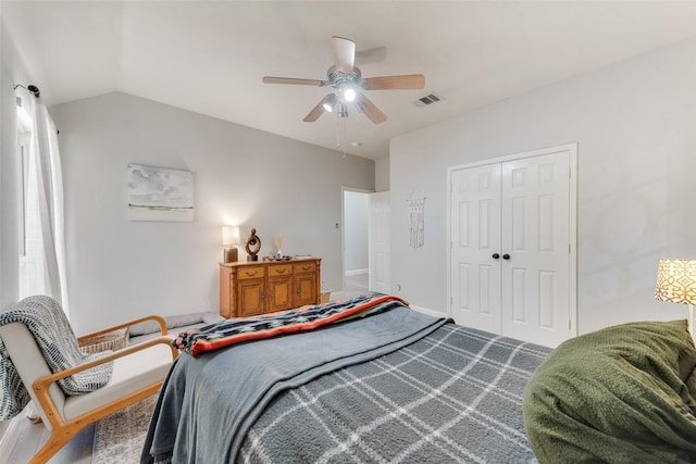 bedroom featuring a closet, lofted ceiling, and ceiling fan