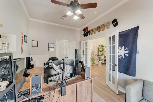 office area featuring crown molding, french doors, ceiling fan, and light hardwood / wood-style floors