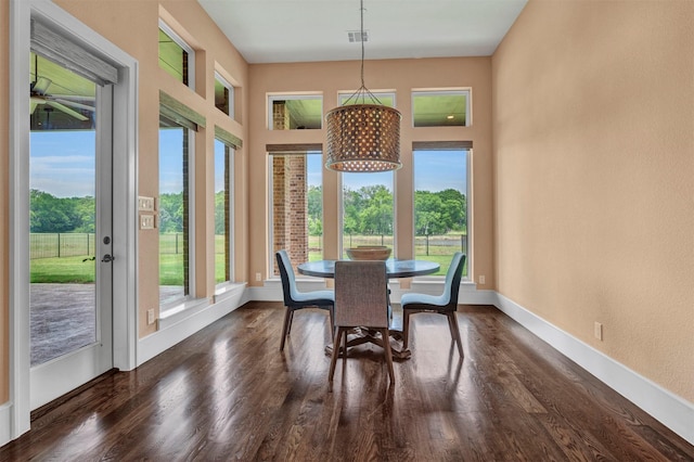 dining room featuring dark hardwood / wood-style flooring