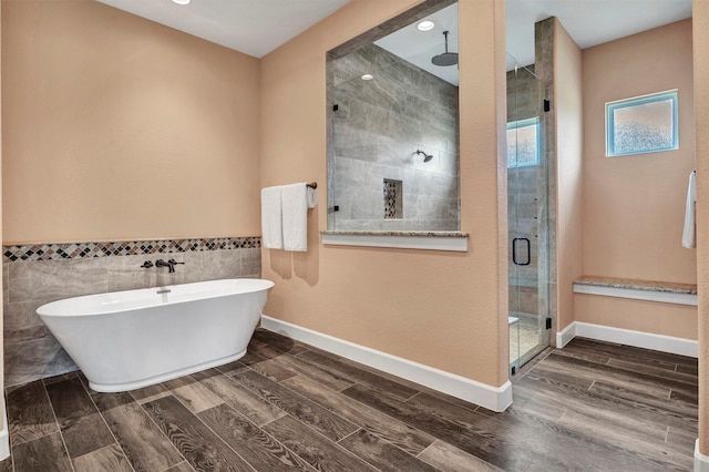 bathroom with independent shower and bath and tile walls