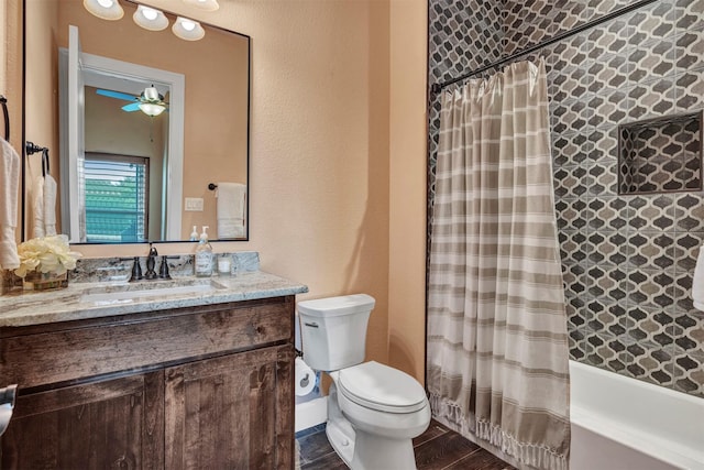 full bathroom featuring vanity, ceiling fan, shower / bath combo with shower curtain, hardwood / wood-style flooring, and toilet