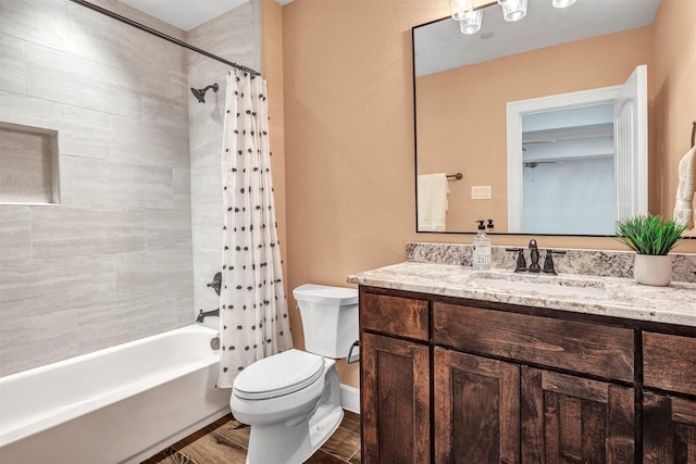 full bathroom featuring vanity, shower / tub combo, and toilet