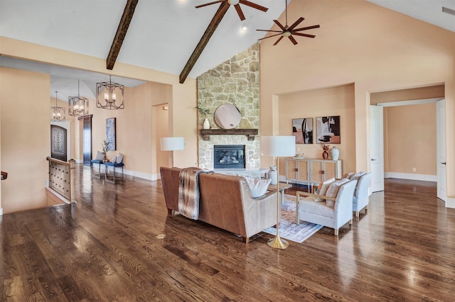 living room featuring dark hardwood / wood-style flooring, ceiling fan with notable chandelier, beam ceiling, high vaulted ceiling, and a fireplace