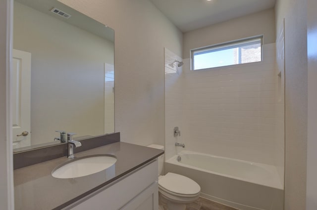 full bathroom featuring vanity, toilet, and shower / washtub combination