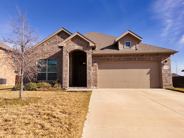 view of front of house featuring a garage and a front yard