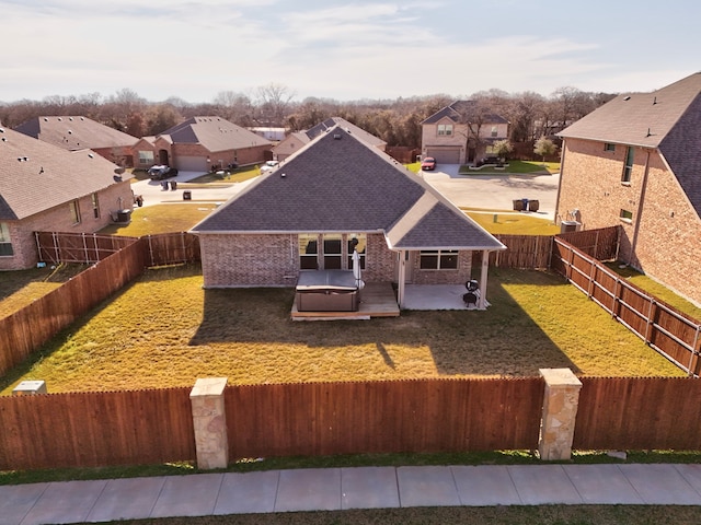 rear view of house featuring a patio area and a lawn