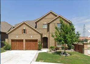 view of front facade with a front yard and a garage