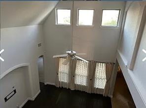 stairway featuring ceiling fan, vaulted ceiling, and french doors