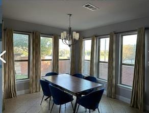 dining space featuring a notable chandelier