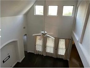 staircase featuring ceiling fan, lofted ceiling, and french doors