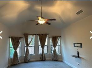 unfurnished room featuring carpet flooring, ceiling fan, and vaulted ceiling