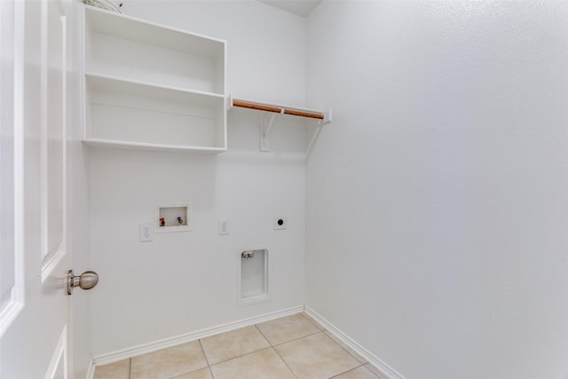 laundry area featuring washer hookup, light tile patterned floors, and electric dryer hookup