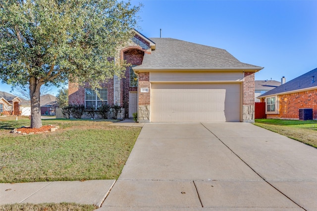 view of front of home featuring central AC, a garage, and a front lawn