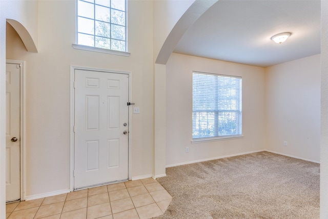 view of carpeted entrance foyer