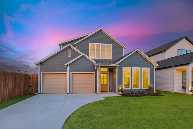 view of front facade with a lawn and a garage