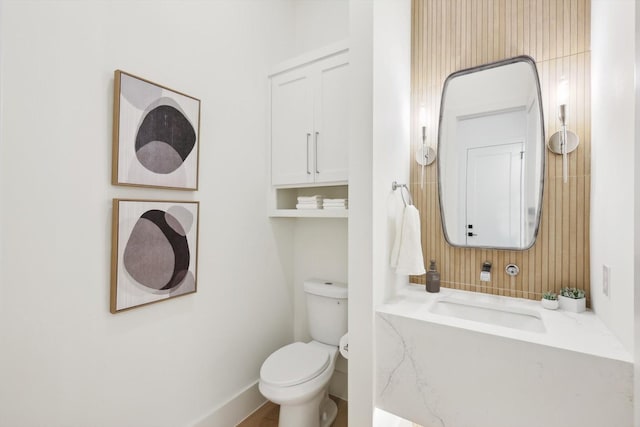 bathroom featuring sink and toilet