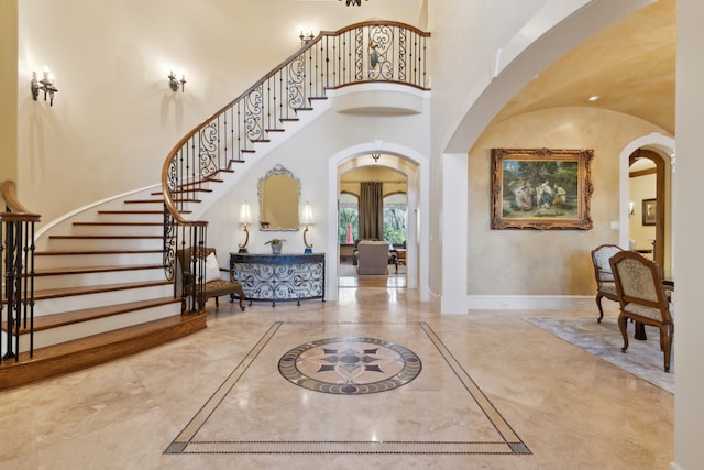 foyer entrance with a high ceiling