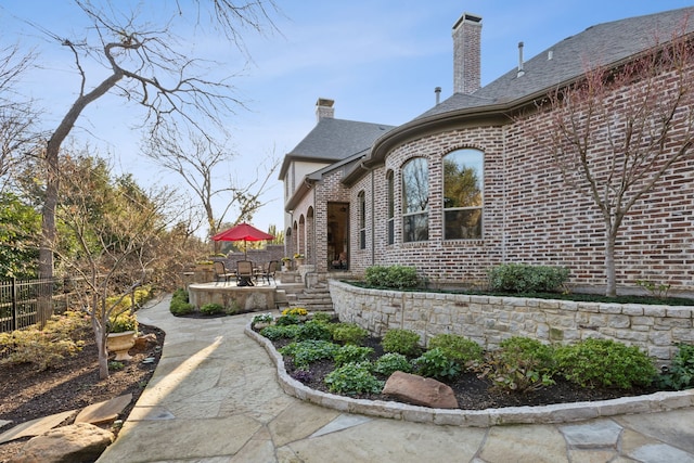 view of property exterior featuring a patio