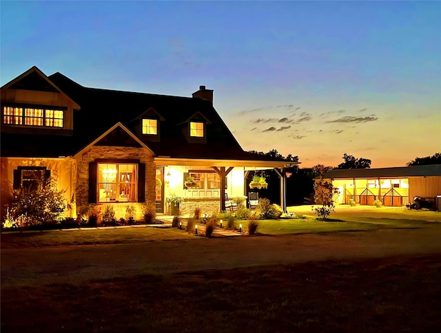 view of front of property featuring a carport