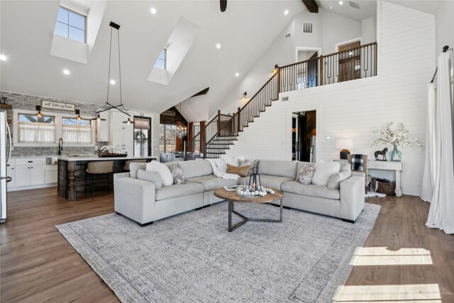 kitchen featuring french doors, decorative light fixtures, a center island, dark hardwood / wood-style floors, and white cabinets