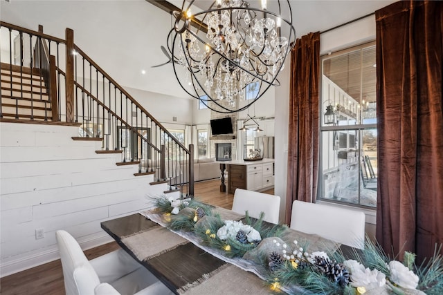 unfurnished dining area with an inviting chandelier and hardwood / wood-style floors