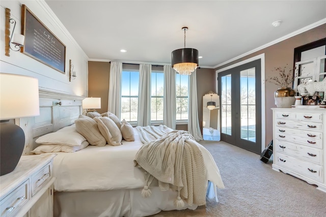 bedroom with multiple windows, crown molding, light carpet, and access to exterior