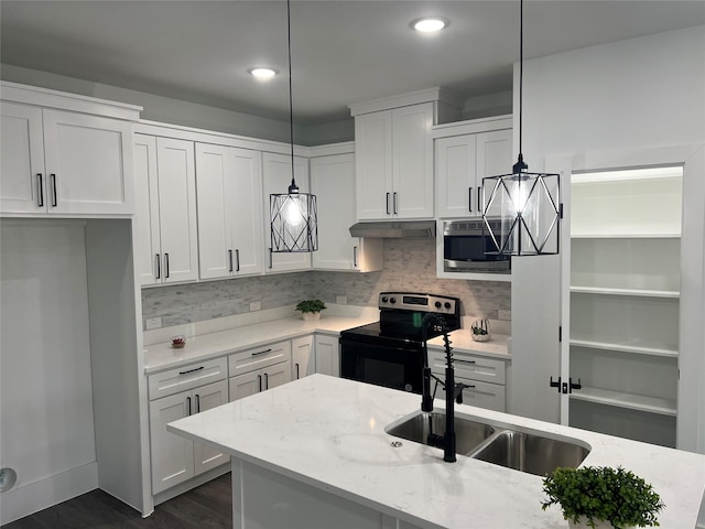 kitchen with sink, decorative light fixtures, light stone counters, white cabinetry, and stainless steel appliances