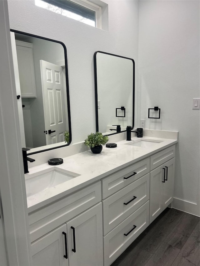 bathroom featuring hardwood / wood-style floors and vanity