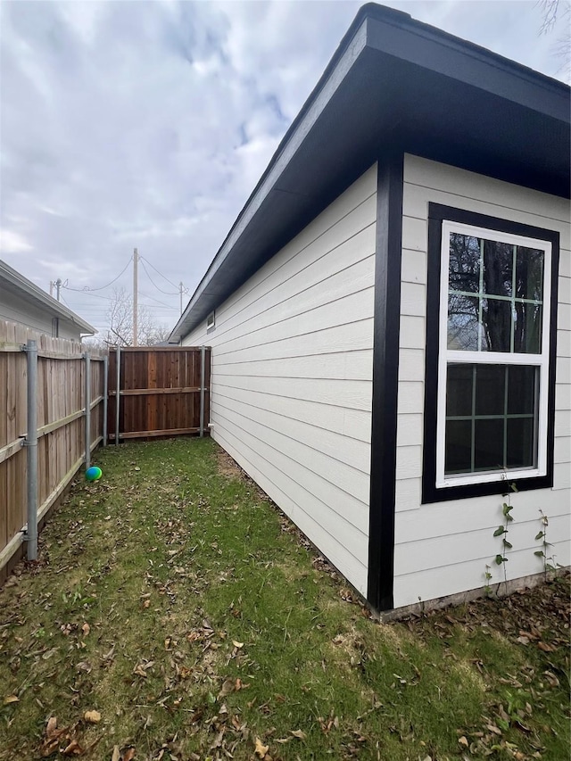 view of home's exterior with a lawn