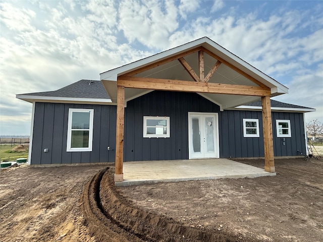 rear view of house featuring a patio area and french doors