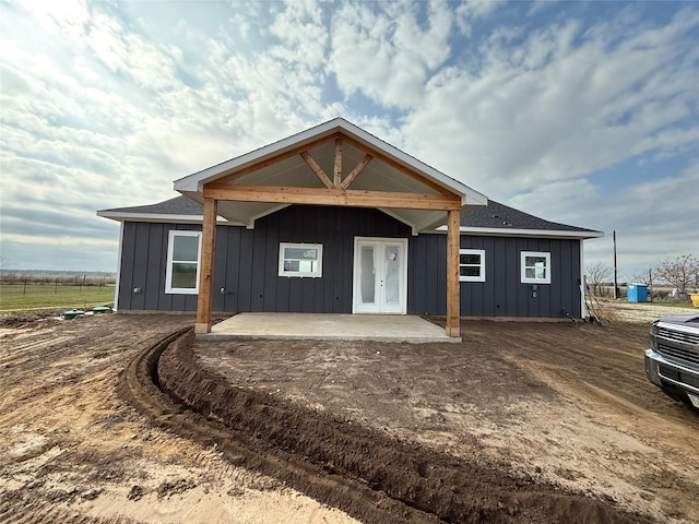 view of front facade with a patio area and french doors